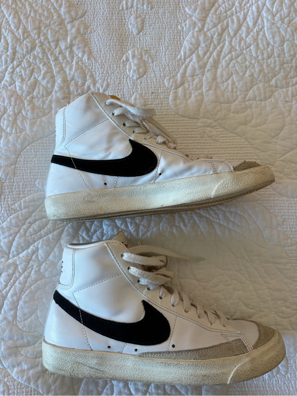 Nike White High-Top Sneakers with Black Swoosh